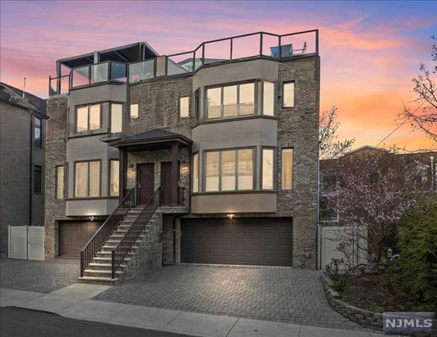 Discover townhouse living at 15 Winterburn Place, a 21'-wide townhouse located in Edgewater.Built in 2015, this south-facing home boasts 9 Ft ceiling heights, a beautifully landscaped garden, all flooded with natural light through its three exposures.Enter into a bright, open living room, dining room,and kitchen plus den and separate butlers pantry. Follow thru to a cozy patio.The primary suite boasts cathedral ceilings,2 walk in closets & ensuite bath. 2 more bedrooms and full bath on the 2nd floor. Rooftop deck boasts classy views of the Manhattan skyline,home office & storage. Basement with an extra room, family room and walk out to the garden, full bath and ample closets. High-end stainless steel appliances from Wolf & Sub-Zero, 2 car garage fitted with steel storage closets,Solar Panels, Restoration hardware light fixtures,smart thermostats, ring cameras & Irrigation system.Conveniently located to bus stop, ferry terminal, shopping like Whole Foods, Trader Joe & Mitsuwa & EVG