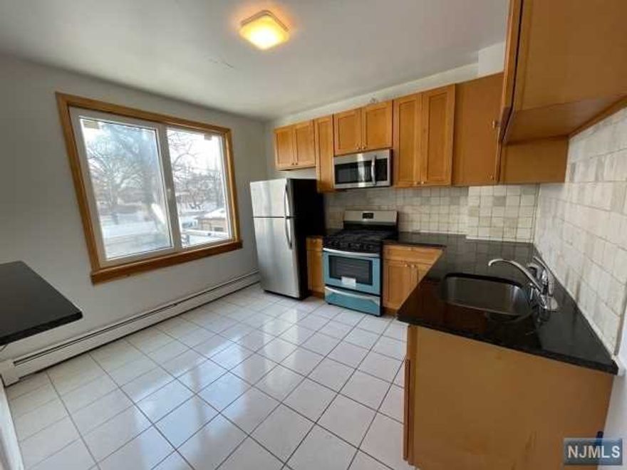 Newly renovated apartment. Living room, dining area, modern EIK with S.S appliances. Large bedroom and updated bathroom in the heart of Bergenfield. This apartment comes with a designated parking space. Walking distance to school, shopping and public transportation. Owner has NJ real estate license.