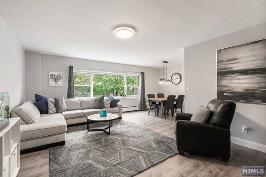 Beautiful charming 2 bedroom 2 bath condo located in the heart of Fort Lee. It features Newly updated modern kitchen with Quartz countertops, Stainless steel appliances, Large Pantry and Hardwood floors Throughout. Primary bedroom and 2nd bedroom are located an opposite side with updated full bathrooms on each side. This unit has an Abundant natural lights and airy green tree views from the windows. ***Low Monthly Maintenance included with Hot & Cold Water, Gas and Heat*** One assigned parking space available at additional charge of $30. Move in Ready!