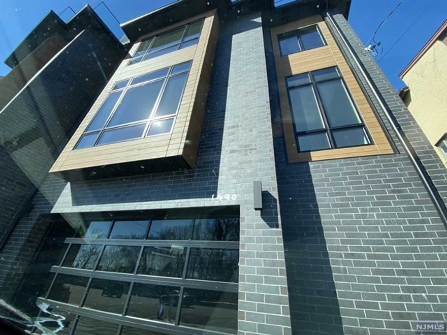 2022 Magnificent Oversized 4 Level State of the Art Townhouse with a 4 Floor Elevator and Large Rooftop Deck with NY View. Floor to Ceiling Windows. Gorgeous Kitchen with huge island and Thermador Stainless Steel Appliances. Radiant Heat in the kitchen, dining room, all baths, recreation room, and garage. Spacious 4 BRs, 4 Full Baths, and 2 Half Baths. 3 of the 4 Bedrooms have ensuite baths. Living Room features a fireplace and 13 Ft Ceilings. Top Floor features a lounge room with fireplace and wet bar, 4th bedroom, a full bath, and sliders to a huge rooftop deck with NY View. Finest attention to detail and high end quality throughout! Private yard with patio. Seller financing available with 1,500,000 down payment.