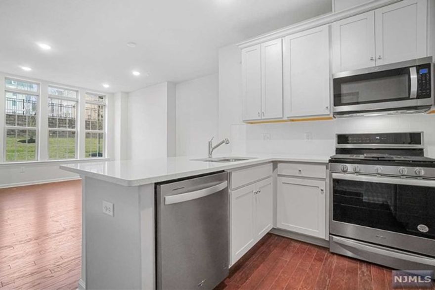 Available for Immediate Move-In to this luxury 2 bed 2 bath townhome is awaiting for its new tenants! Get welcomed by a landscaped courtyard providing green space view. This townhome features a generous living/dining area with over-sized windows and hardwood flooring throughout the 1st level. Beautiful kitchen with SS appliances, Quartz countertop and pantry. Large master bdrm with a custom built-in walk-in closet, master bath with upgraded modern vanity & soaking tub. The second floor also offers bedrm #2, an in-home washer/dryer & Linen closet for more storage. Attached 1 car garage + 1 car driveway. Link @ Wesmont Station is conveniently located from NJ Transit train & bus stops for easy commute to NYC & near all major roadways, shopping, dining. Onsite Dunkin Donuts & kids park. Enjoy the luxury of Sports athletic complex at your doorstep. Bonus features: RO system in Kitchen for drinking water, built in closets in both bedrooms, finished garage with shelves for storage & mor