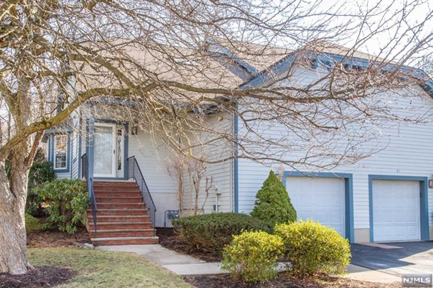 Welcome to Ridge Rise a much sought after community in Wayne! This end unit townhome has been freshly painted and is in move in ready condition! This fabulous bright and airy townhome boasts over 1700 sq. feet plus a huge finished basement, an open floor plan and oversized windows inviting natural light. This 2 Bedroom, 3 Bath home has an inviting feel from the moment you walk in, with an expansive Dining Room open to Family Room with wood-burning fireplace and access to wrap around private deck and serene surround. An updated Kitchen with new stainless steel appliances and granite counters just installed opens to main living areas. This unit has a split Bedroom floor plan with a main floor Bedroom and adjacent full bath and a second floor suite of a huge bedroom, 2 walk-in closets plus a private en-suite bath with double vanity, soaking tub and shower. The HUGE basement is an added bonus, offering a full bath, plenty of storage plus Rec Room and office area.2021 NEW HVAC