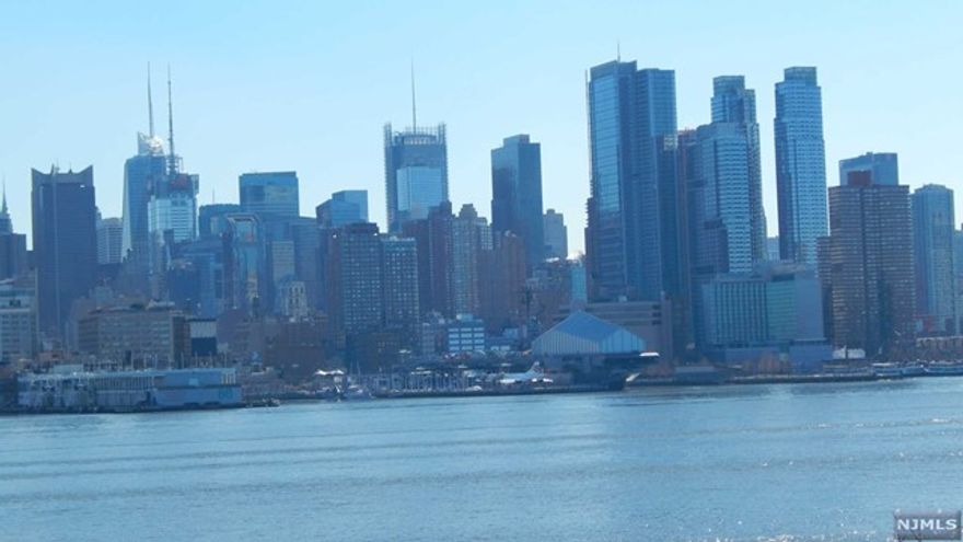 AMAZING CONDO AT THE VIEWS AT HUDSON POINTE! THIS 3 BEDROOM, 2 BATHROOM SOUTHEAST FACING HOME WITH PLENTY OF SUNLIGHT FEATURES BEAUTIFUL VIEWS OF THE MANHATTAN SKYLINE AND HUDSON RIVER. GREAT LAYOUT WITH UPGRADED HARDWOOD FLOORS THROUGHOUT THE UNIT. THE GOURMET KITCHEN IS FULLY UPGRADED TO INCLUDE SUB-ZERO AND VIKING STAINLESS STEEL APPLIANCES AND GRANITE COUNTER-TOPS. EASY COMMUTE TO MANHATTAN. CONDO ALSO COMES WITH 2 INDOOR PARKING SPACES. THE VIEWS AT HUDSON POINTE IS A FULL SERVICE, WATERFRONT COMMUNITY OFFERING 24 HOUR CONCIERGE SERVICE, FITNESS CENTER, WATERFRONT SWIMMING POOL, AND THEATER ROOM.