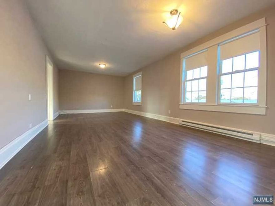 UTILITIES INCLUDED! PETS ALLOWED! Renovated and spacious 2 bedroom / 1 bath apartment. Perfect for NYC commuters, this apartment is in close proximity to the Broadway Train Station. Private entrance with one flight of stairs leads into this bright and airy apartment. New kitchen with rich cabinets and granite countertops. New bathroom with washer/dryer in the unit! Huge dining room/ living room with large windows appeal to modern aesthetics. Two large bedrooms with ample closet space complete this apartment. Includes electric, heat, and hot water! Parking included as well!