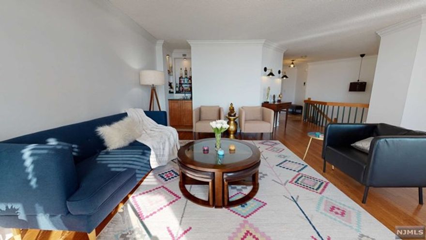 Renovated, 3 bedrooms +1 loft, 2.5 baths duplex offers 1832 sq ft of living space, with 2 walk-out terraces. Large eat-in kitchen w/ SS appliances, high-end kitchen cabinets & granite counter tops plus open dining area, w/ glass sliders to terrace, Living room, in-built BAR & stunning powder room. H/wood floors throughout/ New engineered h/wood floors on the 2nd floor! Loft on the second floor can be used as an office/ kids play area w/ HIGH END CLOSETS. Master bedroom suite has a renovated master bath w/ double vanity, tub, walk-in closet, an oversized additional window & a pvt terrace. Attached Guest bthrm w/ Guest bedroom. Spectacular sunset/river views from both the terraces. Next to the elevator, very bright & ample storage. Central heat & A/C, W/D in unit, & 1 indoor parking. Harmon Cove Towers is an amenity rich building incl 24hr drmn/concierge, security, elevators, pool/kids pool, gym, steam rm, basketball/tennis courts, Nursery, Game room & play area. Commuter's dream!