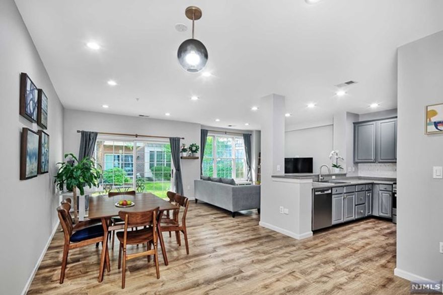 Bull's Ferry Bergen style home on a quiet cul-de-sac. Open living/dining area leading to a glass slider to private patio. Private balcony off of master bedroom. Custom flooring throughout installed in 2021. Custom lighting throughout. Kitchen features stainless steel appliances and custom backsplash. Renovated master bathroom features separate shower and tub and double sink. Large walk-in closet in master bedroom. New furnace and air conditioning system-replaced in 2023. Nest thermostat and doorbell. Parking for two cars; one in private garage and one in driveway. Sought after community features two pools with Jacuzzis, tot lot and free shuttle to NY Waterway ferry. Steps to 158 bus to NYC. Close to restaurants and shopping. Do not miss this opportunity!