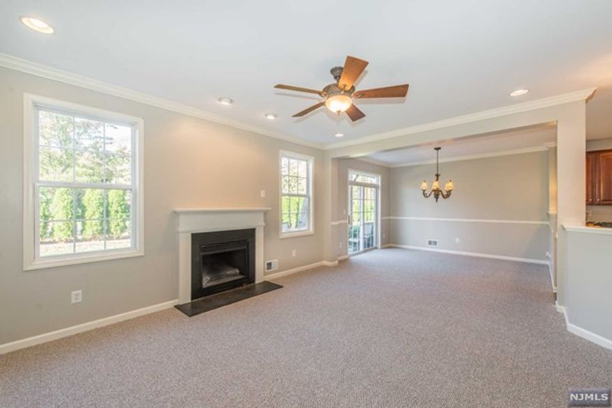 FABULOUS SUSSEX MODEL! LARGEST IN CAMBRIDGE CROSSINGS. ONE OF VERY FEW WITH NO STAIRS TO ENTER! IMMACULATE HOME. GREAT PHASE 1 LOCATION. FEATURES INCLUDE 42 INCH CHERRY KITCHEN CABINETS, UPGRADED APPLIANCES (WALL-OVEN, COOK TOP, BUILT-IN MICROWAVE), CROWN MOULDING, HARDWOOD FLOORS, GORGEOUS CERAMIC TILED BATHROOMS, LIVING ROOM FIREPLACE, WALK-OUT TO PATIO, EXTRA LUXURIOUS MASTER SUITE (DOUBLE DOOR ENTRY, SITTING ROOM, HUGE WALK-IN CLOSET, AMAZING FULL BATHROOM), SECOND BEDROOM HAS A VAULTED CEILING AND WALK-IN CLOSET. SO MUCH SPACE AND STORAGE! WOW! GATED COMMUNITY, POOL, EXERCISE ROOM, SAUNAS, CLUBHOUSE AND MORE. CONVENIENT LOCATION! LESS THAN 1 MILE FROM TRAIN STATION AND BUS.