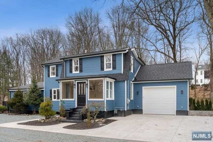 Welcome to this amazing 5-bedroom, 4.5-bathroom property in the Redwood/Pleasantdale section of West Orange just 14 miles from NYC. Boasting a complete renovation with high-efficiency systems and upscale finishes that gives you an ideal blend of comfort, functionality, and luxury. The first floor welcomes you with a porch entrance, living room, kitchen with quartz countertops and stainless steel appliances, a powder room, and a formal dining room. Additionally, there's a great room, full bath, and an enclosed terrace with a hot tub and skylights for perfect entertaining. This floor also includes an in-law suite with a bedroom and full bathroom, with separate entrance ideal for extended family. The second floor comprises three bedrooms, main bath, and the master suite with a full bath and balcony. Notable features are multi-zone HVAC, attached garage, and private balcony and deck from the master suite. Situated in a perfect location that combines privacy and convenience.