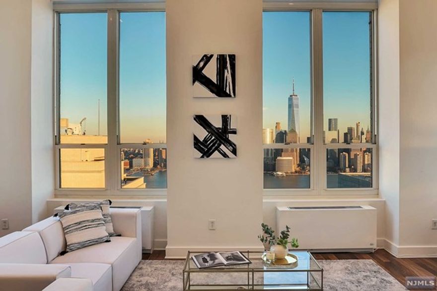 This spectacular & unique Penthouse is a feast for the senses! From the moment you enter the grand lobby until you reach the threshold of your sleek, chic residence you feel the difference of what a luxury lifestyle is. Chef's kitchen with NYC sight lines through the 15' windows in the living room flowing into the majestic 22' ceilings, banquet-sized dining room & breathtaking panoramic skyline views to relish and appreciate. Offering 3 bedroom / 3 baths with abundant storage & closets. To add to the experience - your own private elevator delivering you to a rooftop terrace overlooking NYC's historic skyline with Hudson River views from the Verrazano to the GWB, perfect for entertaining or relaxing after a long day. Expansive terrace is equipped with a waterline, gas line & storage. Amenities feature: Doorman & Concierge, pool, spa, gym, media & games room, residence lounge with kitchen & parking available. A treasure to behold, a location to be envied, a home to be desired.