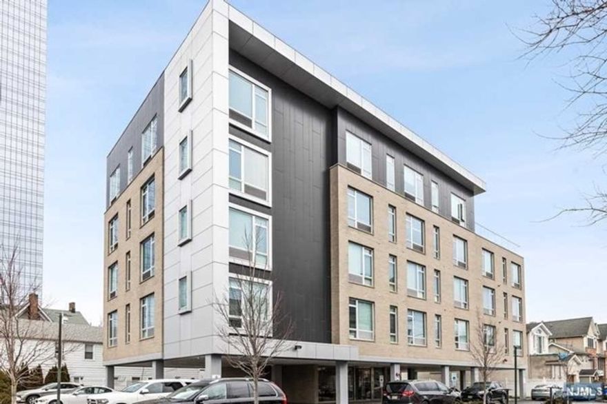 The Cosmopolitan, a boutique style rental building just a walk to Fort Lee downtown; Hudson lights, iPic theater, restaurants and shopping. Beautifully designed and decorated lobby, secured building with access panel and cameras. The apartment offers 9-foot ceilings & Open floor plans Kitchen, Living and Dining. The Custom kitchen offer all white high end 42" cabinets with black granite counter tops. All GE appliances, Gas cooking and overhead microwave with exhaust hoods. A large master bedroom, master bath and a walk-in closet. A spacious 2nd bedroom with a full bath and walk in closet. All 8-foot windows allow lots of natural light and a spacious modern interior. An assigned car space is included. Easy walk to center of town, parks, shopping, cafes, and NYC transportation. A walk to GWB. Great location, beautiful apartment!