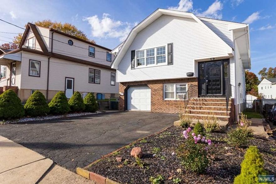 This beautiful 3 bedroom apartment features gleaming hard wood floors, large rooms, a deck leading to the amazing backyard. Great for entertaining! Parking included! Located in the center of desirable Elmwood Park! This beauty will not last! Come and see it today!