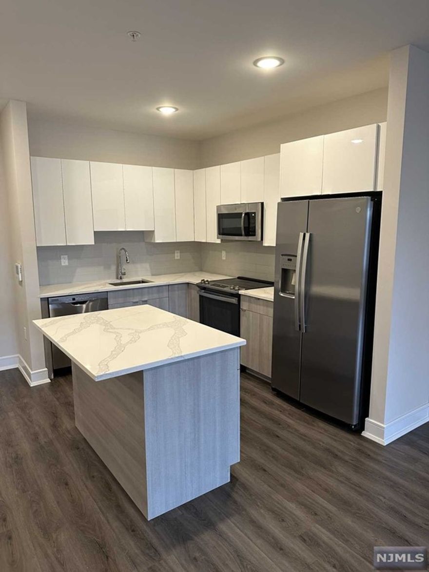 Welcome to the Metro, Fort Lee's newest luxury building. 1 parking space INCLUDED, and REDUCED security to qualified applicants - The Metro features a variety of upscale, spacious floorplans. high-end residences fully equipped w/ modern kitchens w/ stainless steel appliances, quartz countertops, full islands & tiled backsplashes, open living/dining areas, shades on all windows, modern bathrooms & a full-sized washer & dryer in each unit. The Metro features a large elegant lobby, outdoor courtyard, outdoor terrace/garden, large club room and a on-site fitness center, which includes the Echelon Reflect mirror , electric car charging stations & INDOOR (covered) parking garage w/ direct elevator access to all residences for uncompromising security. Pet friendly ! (LB limit & fees apply) Tenants pay utilities. All amenities & one garage parking space is included.