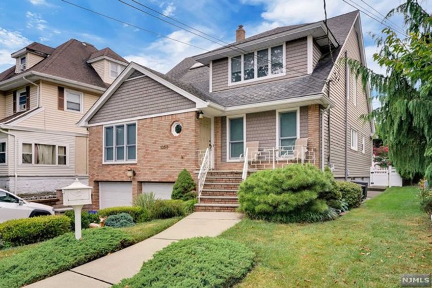 Upscale, second floor apartment in a 2 family house on prestigious Abbott Blvd. Freshly painted, bright and spacious, this 2BR/1Bath w/jacuzzi and skylight, has an EIK with newer appliances and skylight, formal dining room, huge living room, storage space, washer and dryer in unit and, of course, central air conditioning ! This unit includes an indoor garage space plus one on the driveway, shared use of manicured backyard. Tenant is responsible for electric and cable ONLY. Landlord pays for gas, heat, water, lawn care and snow removal. NO PETS PLEASE. Close to NYC bound buses and shopping. Abbott Blvd offers quiet, tree lined street perfect for your morning walks and evening, after dinner, strolls.