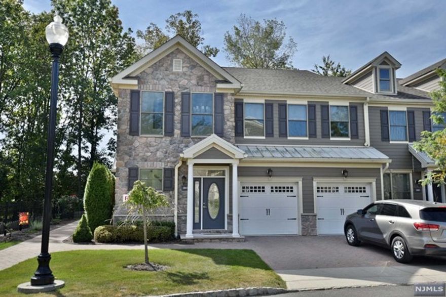 This pristine Whitney townhouse is loaded with upgrades and upscale finishes. With its oversized open floor plan, this home is perfect for entertaining. It includes a large island/breakfast bar, high end appliances, (including a wine fridge), tray ceilings, a Fireplace in the LR and beautiful wide plank flooring. Luxurious Master Bedroom Suite with a balcony, huge walk in closet, and a beautiful master bath with jetted tub. Large laundry area with extra shelving for storage. Custom Lighting and Chandeliers throughout. Upgraded Cabinetry, quartz countertops and more...This one level home has 1775 square feet of living space plus 800 sq ft in the basement, perfect for home office, gym, playroom or storage. Wonderful lifestyle at the Whitney with its beautiful clubhouse, pool, playground and walking path to train and downtown Allendale. Truly a beautiful home, won't last!!!