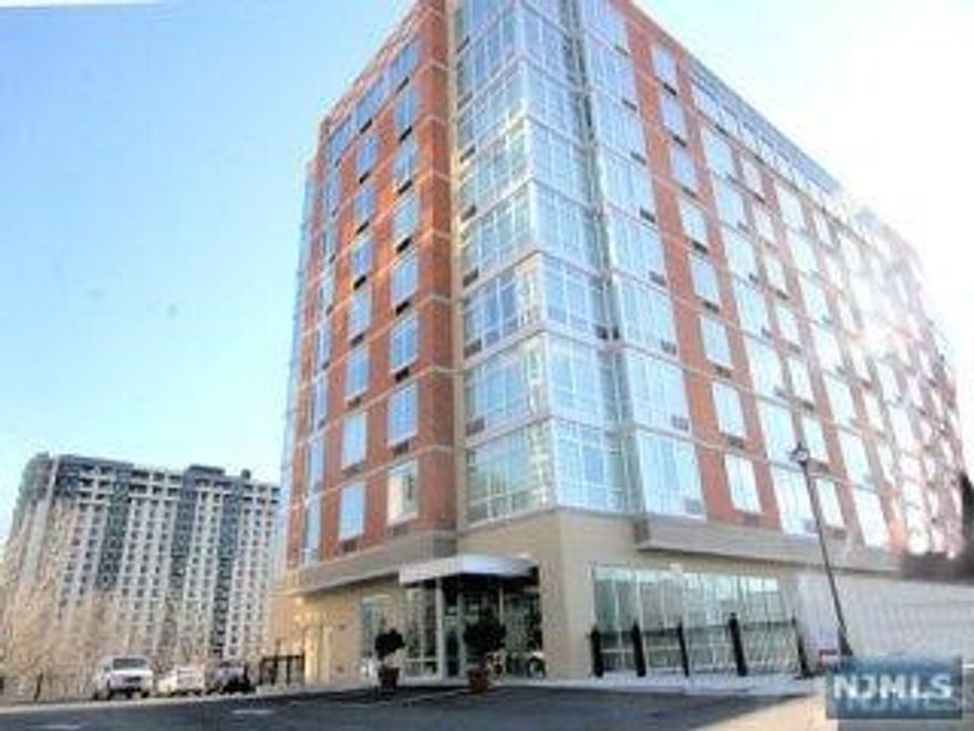 BRIGHT MODERN BLDG. 9TH FLOOR, HIGHER CEILING. OPEN KITCHEN WITH GRANITE COUNTER TOPS,STAINLESS STEEL APPLIANCES, GRANITE & MARBLE BATH AND HARDWOOD FLOOR THROUGHOUT. RENT INCLUDES 2 INDOOR PARKING SPOTS, GAS, COOKING GAS, HEATING, HOT WATER AND WATER (YOU PAY FOR ONLY ELECTRICITY). AMENITIES INCLUDING DOORMAN, GYM, YOGA STUDIO, LOUNGE, GOLF SIMULATION, BUSINESS CENTER AND CHILDREN'S PLAYROOM. CONVENIENT LIVING AREA.