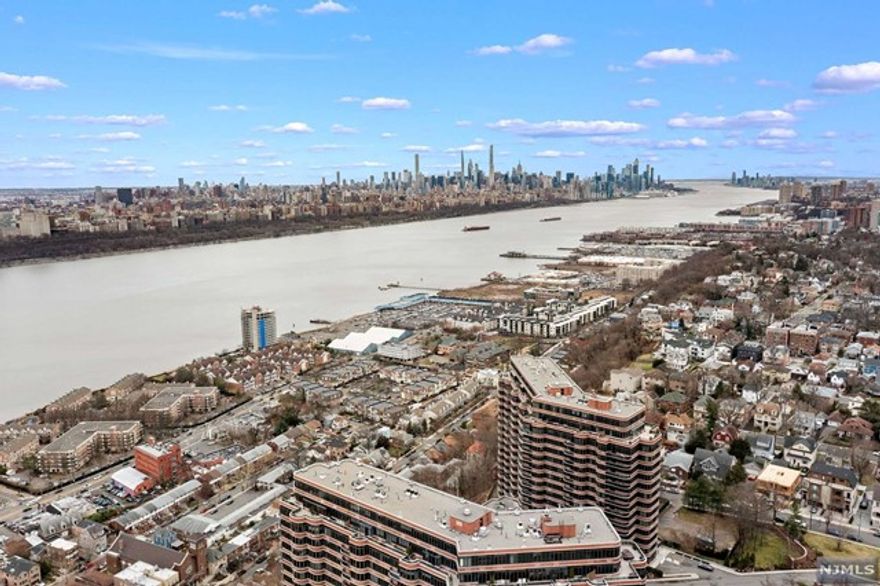 Sought-after Carlyle Towers offering MINT condition corner residence! One of the LARGEST 1 br/1.5bth units filled with natural light. Enjoy luxury living at its finest from this perfect 1-bedroom offering an ideal lay-out with approximately 1201 living sqtf. 9ft Ceilings, in-unit laundry. Oversized Master Bedroom suite east facing, en-suite bath & custom ELFA closet. Parquet floors throughout. Massive terrace overlooking serene garden area. FULL luxury amenities include; 24hr concierge, full-time valet, outdoor pool, newly built exercise room, on-site cleaners, and community room. Easy access to NYC via NJ Transit or NY Waterways Ferry System. LOW maintenance of $699.65 includes: hot & cold water, use of all amenities(pool, gym, library), 1 garaged-indoor parking(attached) & storage bin. Taxes $9,249.98.