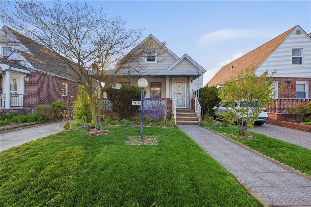 Photo of 118-34 234th Street, Cambria Heights, NY 11411 (MLS # 500872)