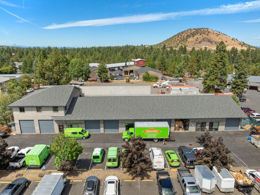 Investor opportunity. Fully occupied sale/leaseback. 5.8% cap rate with annual increases. Long term single tenant NNN lease with ServPro of Bend, a solid franchise locally owned and operated disaster restoration company.  Thriving business largely recession proof.
Well constructed and laid out masonry industrial building.  Ground floor features 6 heated bays with overhead doors, and bathrooms. All overhead gas heaters and thermostats replaced in 2023. Fully upgraded LED lighting throughout.
Approximately 2,000 sf of second floor office.
Complete new roof in 2023.  Good parking and access.  Small fenced storage yard.