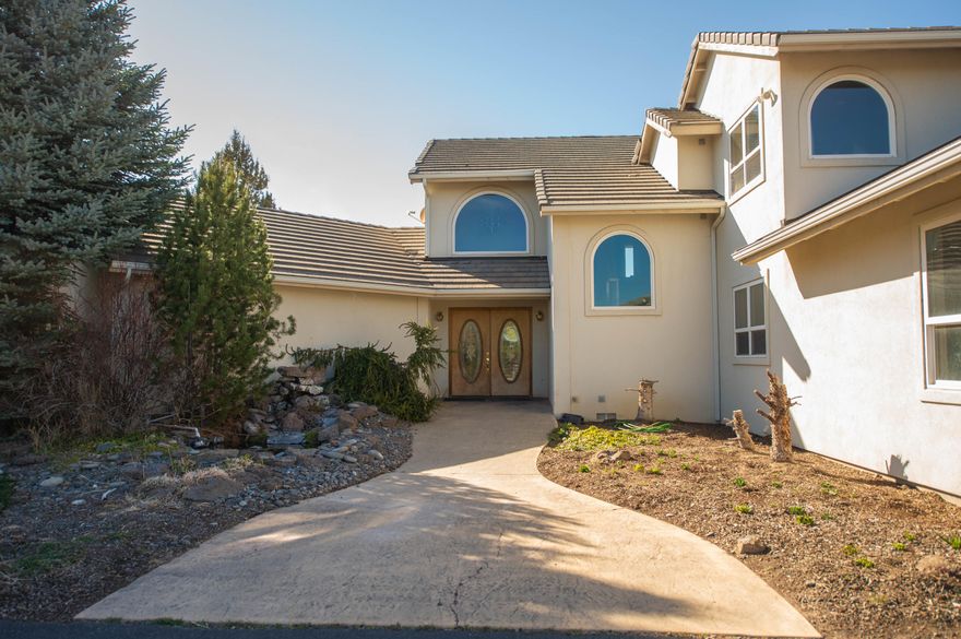 Views! Gorgeous Mountain Views from this established equestrian facility, just minutes from town! The paved driveway leads to this beautifully maintained 3600+/- square foot home, featuring an open floor plan, master suite on the main level, enormous kitchen, family room and living room! The Game Room/Bonus Room upstairs with a full bath, and two additional bedrooms offer every potential opportunity for entertaining friends and family. The view from the home and rear deck over the pond to the Cascades is the perfect spot to gather with friends or enjoy the peace and quiet. The Indoor arena with space for 4 stalls and finished Manager/Ranch Hand Office Space provides year round opportunity to comfortably participate in your favorite hobbies! The fenced and cross-fenced front acreage with 2.3 acres of COID irrigation complete this thoughtfully planned Home.