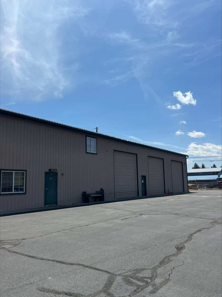Sitting on .64 of an acre is this 10,500 sq ft industrial building in Sisters Industrial Park. This building features several offices as well as an open warehouse areas with three, 14ft roll up doors. The large warehouse area has 3 phase power.