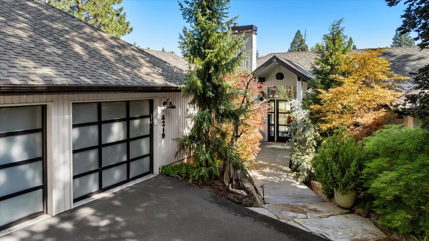 Welcome to Lower Village Sanctuary, where the earth grounds you, the wind carries change, & the Deschutes River flows beneath fiery sunsets and the majestic Cascade Mountains. Perched above the river in one of Bend's most extraordinary settings, this fully remodeled custom home offers sweeping views of the river, canyon, & Cascades, w/ direct river access. Inside, discover vaulted ceilings, wood floors & walls of glass that flood the home with natural light. A chef's kitchen, elegant finishes, & thoughtful design create a perfect harmony of comfort & sophistication. Arrive through a charming garden path w/ water features & lush landscaping, into your private sanctuary. Outside, a rock stairway leads to the river's edge, surrounded by dramatic lava flows & miles of scenic river trails. Whether fishing, exploring scenic river trails, or simply savoring quiet moments, every day here feels like a retreat. A truly special offering, where nature, privacy & luxury converge in perfect harmo