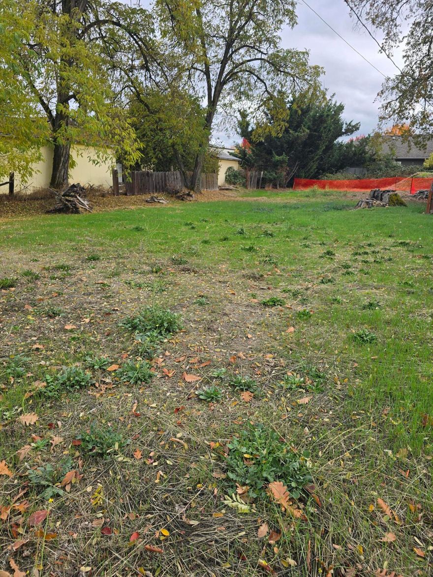 This lot is a great investment for anyone looking to build! It allows for multiple dwellings or a single family home. Double wide manufactured homes are allowed by the city in this area. Utilities available at the street and existing conduits run from the front of the lot to the back. An established easement/shared driveway provides easy access to the property. Located in a growing area close to shops and schools, this lot offers plenty of potential. Don't miss out on this chance to make your investment dreams come true!