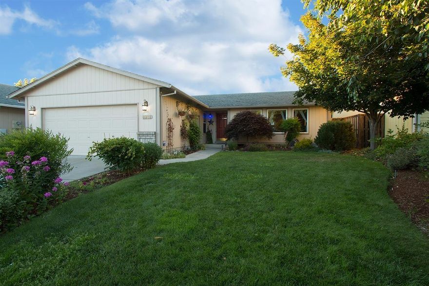 A wonderful home in the City of Central Point. From the inviting front entrance to the fenced back yard, this home on a quiet street is clean, nice, and ready to go! Laminate floors, many other updates, and a patio with an extended seating area. The kitchen opens up to the wonderful family room and dining room. 3 bedrooms, 2 bathrooms, attached two-car garage, quiet street, great price. What else do you need? How about use of the giant clubhouse with the in-ground swimming pool? Hurry, this won't last.