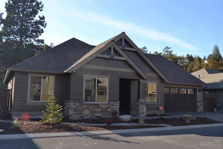 Pahlisch Homes new construction in a gated community, steps from the River Trail in River's Edge. Pahlisch custom quality finishes throughout include inviting entry into great room, coffered ceiling, large windows providing lots of light, quartz counter tops, SS appliances, engineered hardwoods, walk-in closet, and much more. Floorpan: WANOGA 2-B-2273-1.