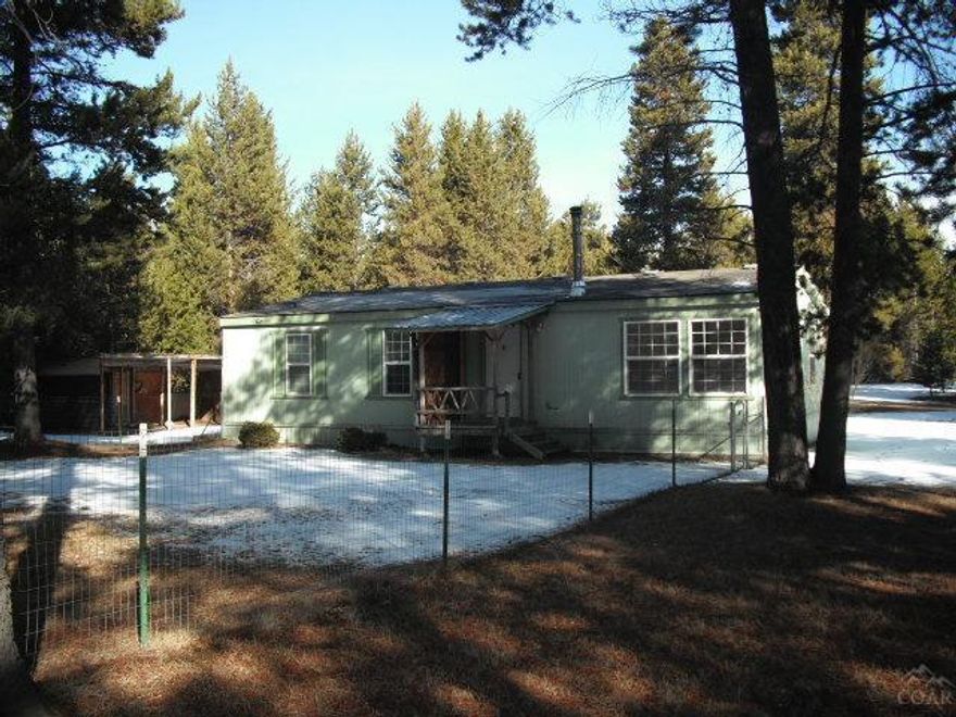 Very comfortable 2 bedroom 2 bath manf home on a very clean corner acre.This is prices to sell must see to appreciate it.Has ceiling fans and nice laundry room. Dining area Lots of windows , so light and comfortable Wood stove included