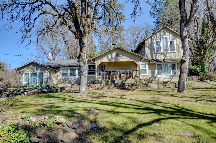 This amazing property has a rural feel just minutes from town. The 1.85 acres is fully fenced/cross fenced with pasture area, garden area,cover for animals and an extravagant chicken coop. Home has been nicely updated with vinyl double pane windows, open floor plan and boasts 3 master suites, 2 on the main level! One master recently remodeled with walk in closet and oversize tile shower. Upstairs master has French doors that open to a claw foot tub in a spa like setting and French doors to the private deck. The spacious kitchen has all new granite including the island, a farm sink, stainless steel appliances and new cabinets. The back patio is the perfect spot for entertaining with freshly poured concrete and a recently added pergola. The studio/shed has power and currently used for animals but could easily be an additional room. The detached shop can fit 2 cars plus workshop area. A great opportunity for a mini ranch or multi-generational living. Call today for your showing!