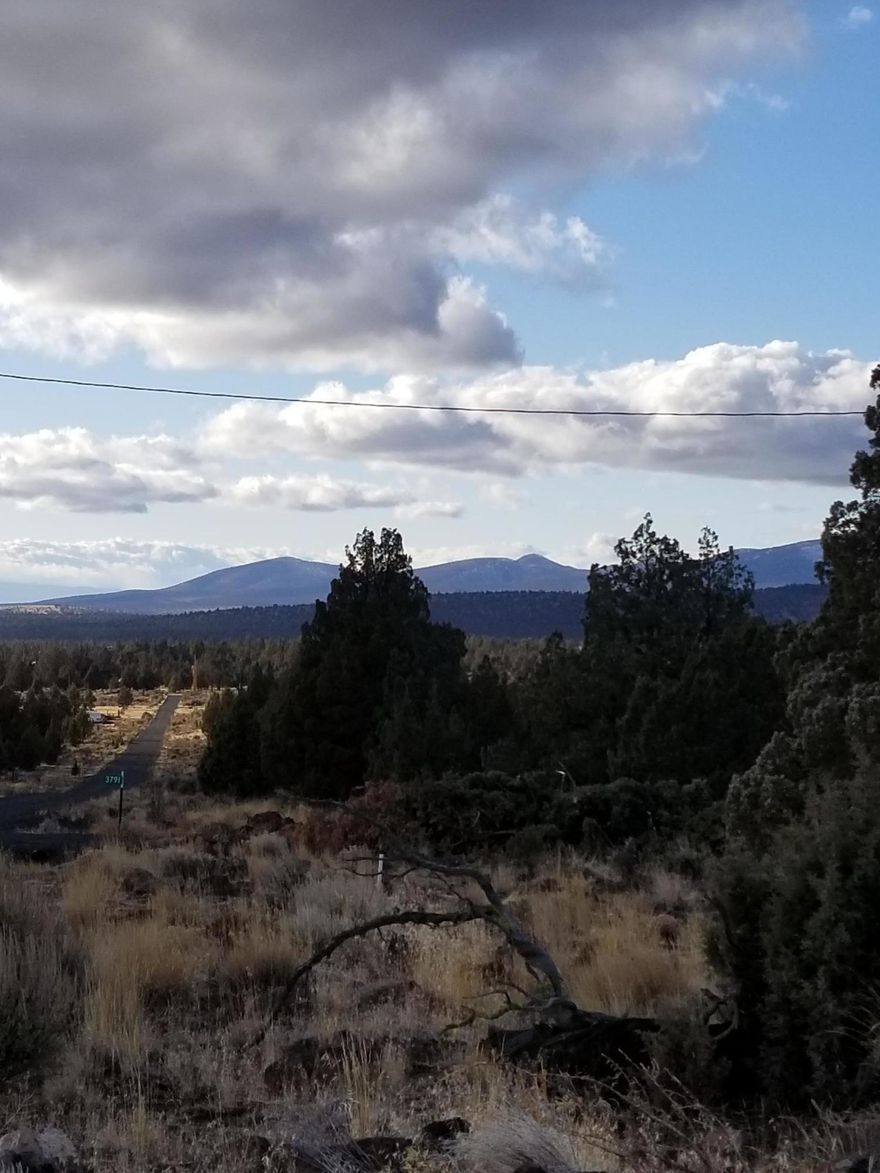 Buildable lot with Views in Prineville Lake Acres 2!  Septic has been installed including capping fill, initial excavation has been done. Culvert added at driveway and homesite leveled. Westerly mountain views! Approved for a Double Wide or home of your choice. Loop Gravel Driveway. Natural Old growth Juniper and Sagebrush on property. Water comes from off site community well, fill and deliver. Electric at street. Out of town about 15 Miles, Perfect for Social Distancing!