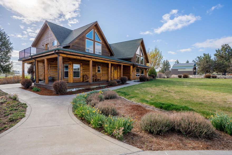Custom home with rustic post & beam logs and contemporary 2x6 construction. Very private setting on 24.7 acres with 13.2 acres of Tumalo Irrigation District water rights. Cascade mountain views with cross-fenced pastures. This would make a great horse property, 1296 sq. ft. shop, 36x60 ft. hay shed, corral with loafing shed, feeding shed for livestock and on-site hay production capability. The stunning open floorplan log home has soaring vaulted wood ceilings, passive solar design, a river rock fireplace and impressive character logs leading to the open loft and spacious master suite. The insulated 720 sq. ft. detached two car garage with heated dog bedroom will keep your cars and pets happy. Grow your own organic vegetables in the fenced 24x48 ft. garden surrounded with plumb trees, raspberries and hops. Paradise on the high desert, minutes from Bend.