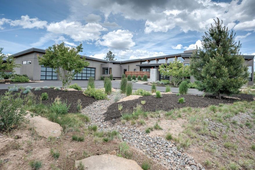 Stunning luxury contemporary home wins the Trifecta: amenities, floor plan, condition. Master suite plus 2 en suites work equally for a couple or a family, theater room, office. Remarkable wood ceiling, 7' plank oak hardwood flooring in Kit/Great Room, accordion door wall w/ clerestory windows graduating along butterfly roof line, natural light everywhere, wool carpeting, luxury mud room, over-the-top storage but then...the whole home is over the top! Outdoor kitchen with gas fire pit. 996 sf garage.