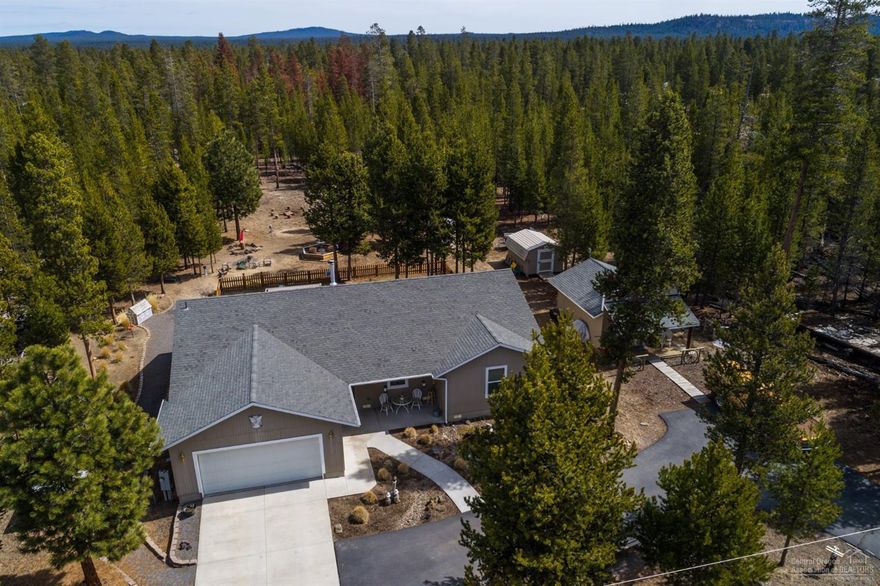 Tranquil setting in this adorable home south of La Pine. Perfect for the hobbyist or crafter or avid deer/bird watcher as the wild life is right outside your back door! Single level open plan, cert. wood stove, pine wainscoting, trim & doors. Granite tile kitchen counters & tile floors + den w/French doors . Master suite has jetted soaker tub, stall shower & marble counter, w/vinyl floors. Standard Septic, great well water. Adjacent 15X20 Hobby or Guest suite is fully finished/heated plus 2 sm. storage she