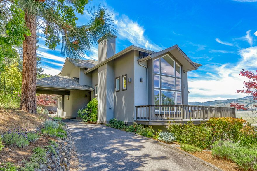 Sophisticated & stunning home with breathtaking expansive views of the city below and mountain range afar. Upon entering the home from the port-cochere, one is met with beauty and grace as the architectural features outline the soaring ceilings, walls of windows and sunken living room with marble surround fireplace. This is an excellent home for entertaining, chef's kitchen has lots of counter space, island with cook top and opens to great room on one end and spacious dining area on the other. The large wrap around deck is perfect for all of your outdoor enjoyment. Main level has guest bedroom and bath. Upstairs has another bedroom w/ bath, office nook and a relaxing master suite with fireplace, balcony and a luxurious master bath with deep soaking tub, dual sinks and a gorgeous glass enclosed shower of Schist Stone w/ quartz vein. Home has been meticulously maintained including recent professional paint job inside and out and new 50-year roof installed in 2015. This is one of a kind.