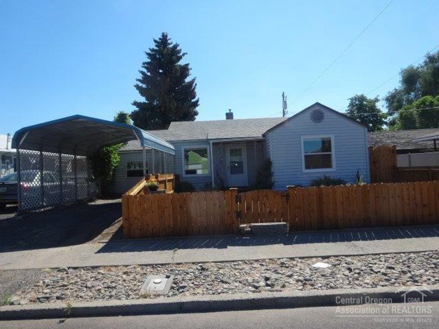 Great starter home or rental located in the downtown core, also zoned for commercial use. Easy maintenance exterior with newer cedar fencing, upgraded roof, vinyl siding and vinyl windows. Wood floors in living room and bedrooms, remodeled bathroom, family/dining room with brick hearth, laundry, gas forced air heating & small private yard, covered patio, storage room and garden shed.