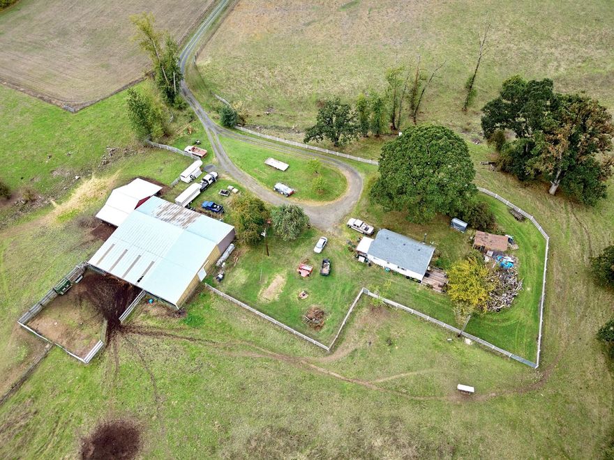 61+ acre property with amazing views of the surrounding farm and ranch country. With a seasonal creek that had water all 2023 summer. The land is currently being used for cattle and hay production. There are two tax lots that can be purchased separately a 21+ and a 40+ acre. The home is currently lived in by the owner but needs work or replaced. Buyer to do due diligence on a replacement dwelling and the possibility of a conditional use permit to build an additional dwelling on the 40. Barn in good cond.