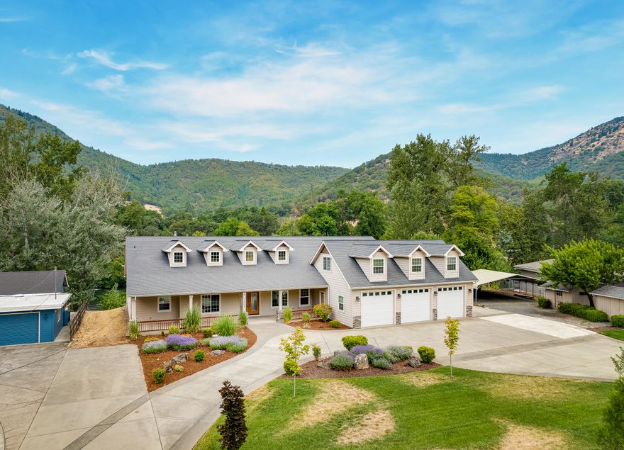 Riverfront property! This incredible 3846 sqft home sits on a large 1.17 acre lot with a gentle slope allowing easy access to the beautiful Rogue River, perfect for swimming/fishing! The single story home includes two large bedrooms (both with walk-in closets), with the master equipped with a spacious bathroom with jetted tub and walk-in shower. There's also a lovely office with a fireplace, just off the entry, that can be used as a third bedroom! In addition, the home has a very large bonus room above the garage, which can have multiple uses. The spacious kitchen offers SS appliances, pantry, kitchen island and breakfast bar. A formal dining room and family room are located in the back of the home, both giving access to the expansive deck overlooking the river. Extras include: freshly painted interior, coffered ceilings, beautiful tile/hardwood flooring, extra large pantry/utility room, large 3-car garage and RV parking with full hookups! This opportunity won't last, call today!