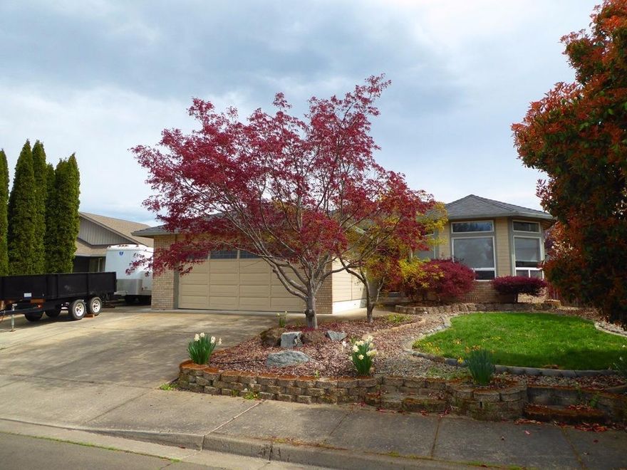 Beautiful, well maintained 3 bedroom, 2 bath home, located in a wonderful Central Point neighborhood. This 1856 sq. ft. home features a new roof as of December 2016, light and bright, open living room with hardwood floors, high ceilings and lots of windows for natural light. The kitchen is open to the dining area and has an island, tile floors and lots of cabinets and counter space. There is a family room off of the kitchen, which is now being used as an office. Spacious master suite and double sinks in the master bath. The back yard has a nice patio area off of the kitchen and family room. There is also a large gazebo that is a wonderful place to barbeque on a nice spring day and there is lots of room to relax. RV parking and a large garden shed.