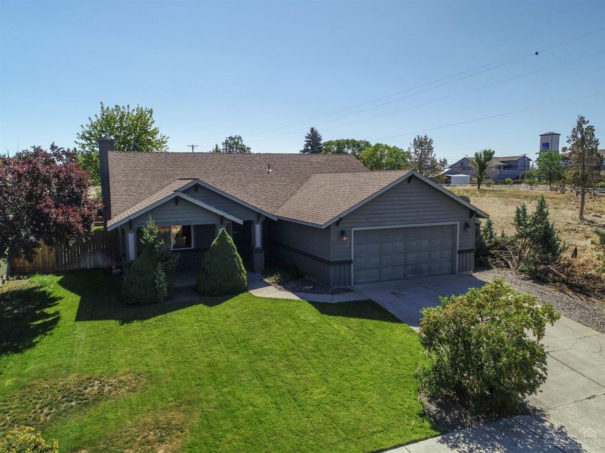 Great Value! Spacious kitchen with lots of cabinet and counter space. Updated Laminate floors throughout. Gas fireplace. Newer forced air furnace and central AC. Large private back yard with large concrete patio. Sprinkler system in front and back. Some cascade mountain views. Great location close to schools and shopping on a well taken care of spacious lot. Must see!