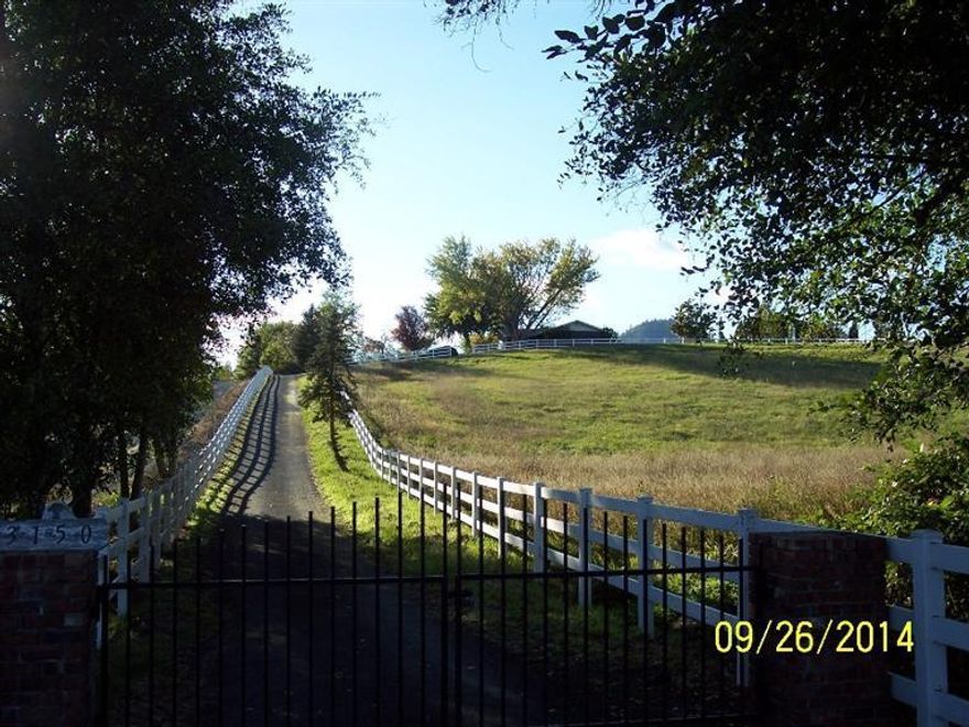 Absolutely one of the most beautiful Knoll Top Settings in the valley! Six irrigated acres surround this nearly 2000 sq. ft. 3 bdrm. 2 bath, single level, ranch style home! Sunken Living room, formal dining room, fireplace in the family room and picture windows to enjoy the fabulous views. Outside is an over sized shop for the handyman of the house, a covered metal roof for the family RV and a pond for the animals to roam around. Bring your imagination, creative ideas and turn this house into a home for your family! Well flow test of 10 GPM on file, Brand New Standard Septic installed on 3/30/15.