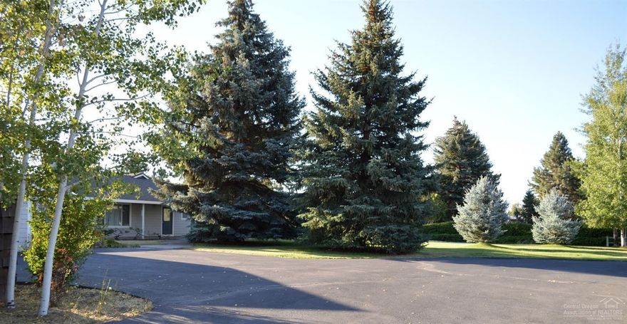 Gardeners delight! Single level home with open main living area, 2 sunrooms for gardening year around. Neatly behind the home you have a state of the art shop. Both situated on 1.15 acres of beautifully manicured lawn, mature landscaping with irrigation rights. The shop is a must see, built 1996 includes: automotive lift, compressor, attached office / kitchen area, full bathroom, laundry and open spacious living area upstairs that makes a perfect guest quarters or a great bonus room.