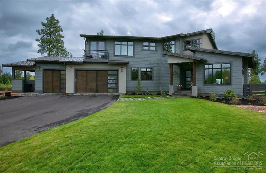 A rare opportunity to own a luxury contemporary home in one of Bends premium locations. Enjoy privacy, views and proximity to all West side amenities. Flooded with light the main level offers a stunning great room with a top of the line kitchen, office & bedroom suite. On the upper level are two additional bedroom suites and a bonus room. An oversized 3 car garage has a portion converted to a finished exercise room, great storage & a dog wash station.