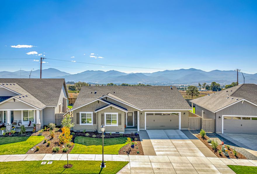 This is a brand new home by Leading Home Builder, Gary Ray, completed in July 2022. Sellers have lived there long enough to have the builder fine tune the details. Located in the desirable Horse Arena Subdivision in SE Medford. This single level, craftsman style home has amazing views of the Siskiyou Mountains including Mt Ashland. Enjoy the open floor plan w/ excellent window placement. Main living area opens to the south which offers year round natural light. This well crafted home features a large kitchen w/ custom cabinets, high end stainless appliances & quartz counters w/ walk-in pantry. Primary suite has plenty of room for a California king bed, oversize tile shower enclosure, large walk-in closet & double vanity w/ separate toilet enclosure. The spacious living room has hardwood flooring throughout w/ access to covered patio. Cozy up to the custom gas fireplace w/ brick surround. The creative attention to detail makes this home one of a kind.