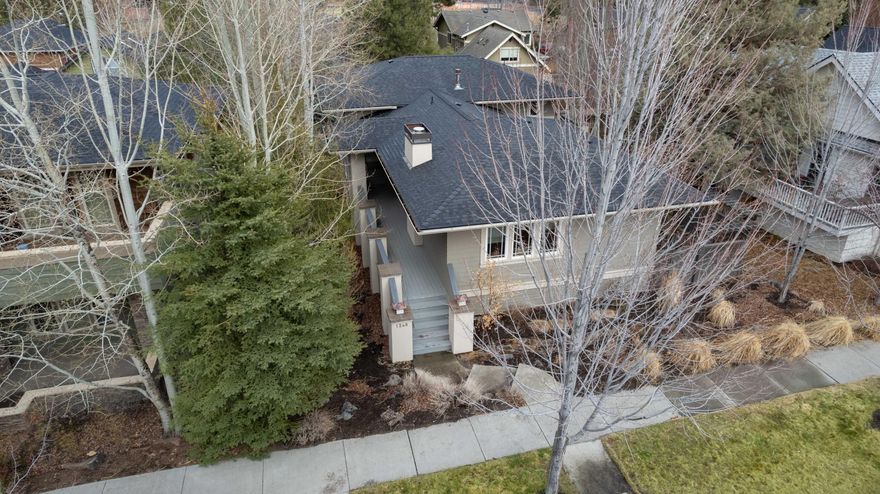 The Bend lifestyle is just out the door of this awesome prairie style home in Northwest Crossing! Only a block from both High Lakes Elementary School and the Shops/Restaurants on NWX main street. The 1900 SF home has been updated and well maintained, including a brand new roof installed last month. Inside you will find a great room that lives large with a beautiful chef's kitchen, lovely picture windows, a wall of built-ins around a huge gas fireplace and a door leading to the deck off the dining room. There are 3 bedrooms/2.5 bathrooms. The bedrooms are up a few steps from the main level. The primary bedroom has a private deck overlooking the yard. The RARE 3 car garage is off the back alley with plenty of additional parking space in the driveway. There is one flight of stairs up from the garage to the main level, then a few stairs up to the bedrooms. The side yard is south facing and fully fenced/landscaped. Come see this home soon!