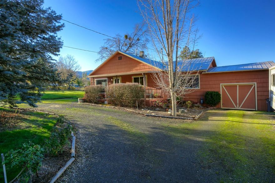 Just over a half acre lot on the outskirts of town sits this quaint cottage style home with two bedrooms, one bathroom and approx 1263 square feet. The large yard is mostly level and has T.I.D. irrigation. There's a large outbuilding that could make a nice shop and/ or a barn depending on ones needs. Close to town location and within the Bellview School zone. Lots of potential at a good price!