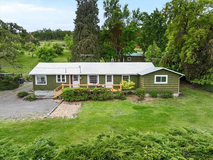 Peaceful Country Living, Minutes from Town!!... Lovingly owned by the same family for nearly seven decades, this 4BD/2BA Home rests on almost 5 gently sloping acres in a rural setting just outside Medford's urban growth boundary, with potential to divide per seller ... buyer to perform due diligence. Take in sweeping valley views and twinkling city lights below!!

Features include hardwood/simulated wood flooring, electric & oil heat, and all appliances. TID (Talent Irrigation District) irrigation newly piped underground (replacing ditch) ideal for gardening or hobby farming.... Established Orchard offers apple, pear, and plum trees. Multiple outbuildings, city sewer, and a private well with purification and reverse osmosis complete this property...  

Shown by Appointment Only; No drive-bys or trespassing without an agent present.