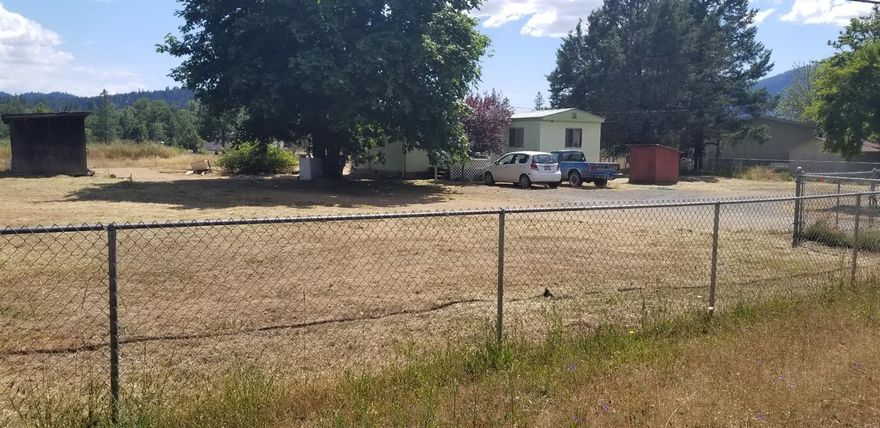 5 acres of year round Deer Creek frontage. 3 bedroom, 1 bath mobile with add-on bonus-room'', metal roof, country front porch. Large sunny garden area. Fenced and gated with circular drive. Long acreage with so much room and potential. Horse ranch along one fence-line. Garden on the other. Room for all your toys. Long drive back to the wooded beach with large laurel (Bay) trees. Cash only - AS-IS'' Sale. Owner will not carry.