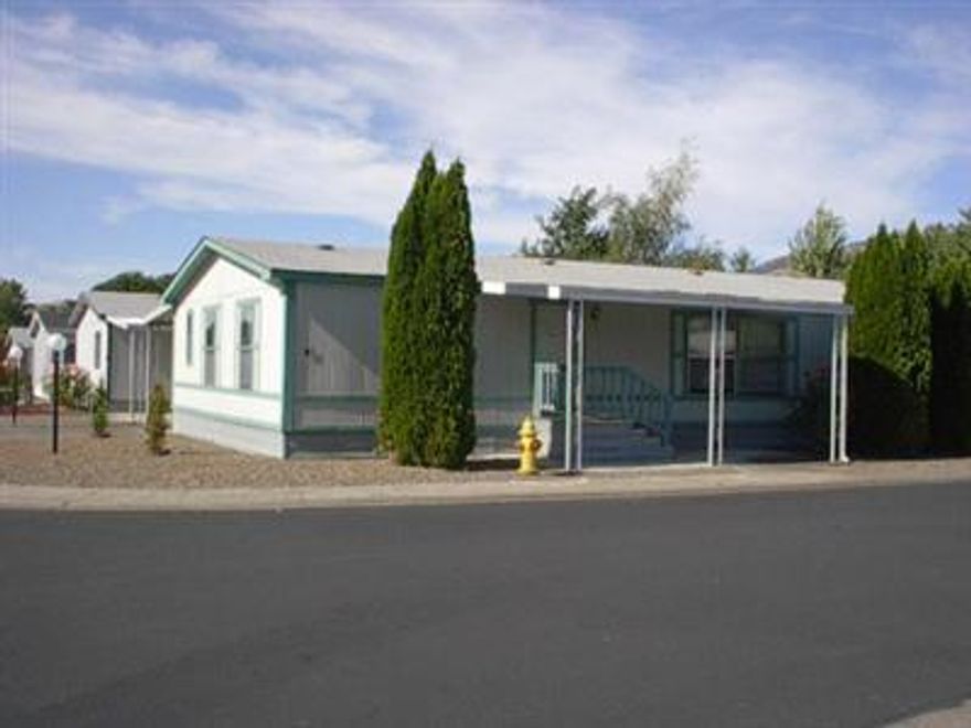 Senior Park: 55+ Greenway Village. $280.00 park fee. Maintenance free yard. 2 car carport with wooden shed. Good condition home with vaulted ceilings, skylights, split fllor plan, spacious kitchen, new washer and dryer included. Move right in. RV parking Home Warranty included.