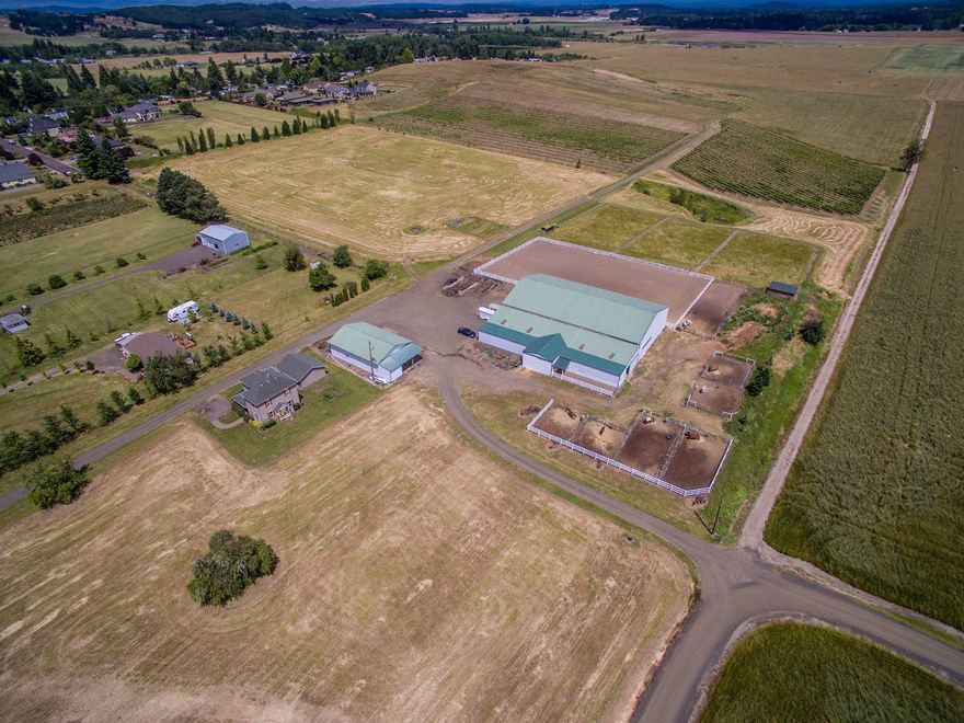 Take this rare opportunity to own a vineyard,farm and horse ranch inside the Corvallis Urban Growth Boundary. This stunning location boasts a quality working 11 stall horse boarding facility and large vineyard. The high quality soils have a variety of potential uses including hazelnut orchard, row crops, grass seed and hay ground. The historic 1896 home has been completely updated to modern standards. Keep the homestead as a rental and build above the vineyard with endless Willamette Valley views.